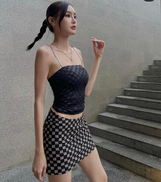 wearing MISBHV BLACK MONOGRAM MINI SKIRT 3021W134