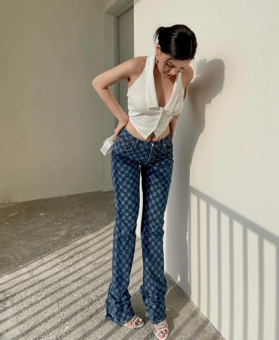 wearing MISBHV BLUE SIGNATURE MONOGRAM DENIM HIGH WAISTED TROUSERS 3021W245