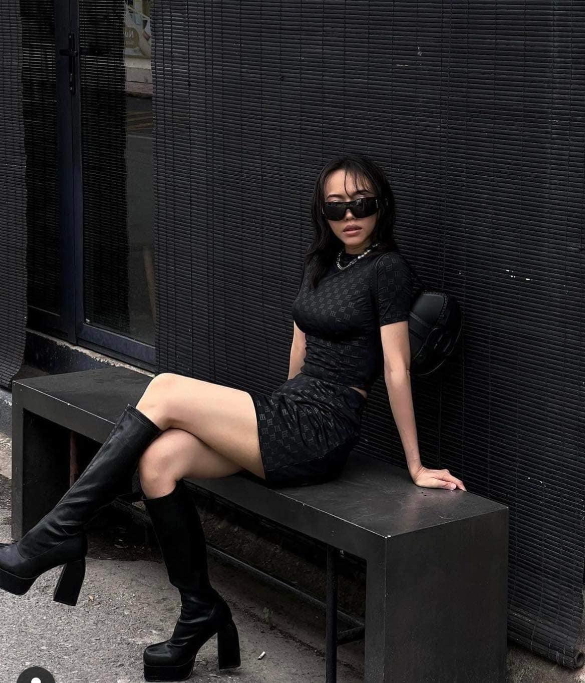 wearing MISBHV FULL BLACK MONOGRAM MINI SKIRT 3022W856