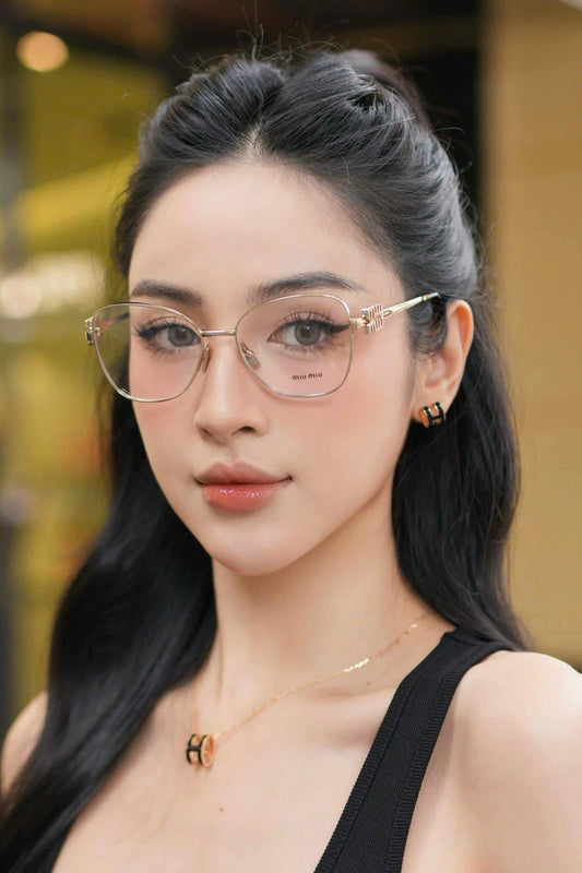 wearing MIU MIU 50XV ZVN1O1 EYEGLASSES GOLD