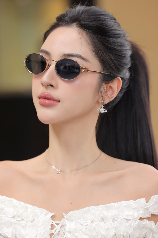 wearing MIU MIU LOGO MU 52YS ZVF1V1 SUNGLASSES BLUE LENSES SMU52Y_EZVF_F01V1_C_054