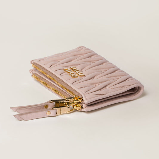 Miu Miu Matelassé Nappa Leather Small Wallet Powder Pink 5ML024_AFPP_F0236with gold zipper on a light beige background