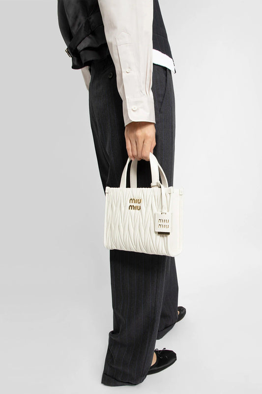 wearing MIU MIU MATELASSÉ TOTE BAG WHITE 5BA277 N88 F0009