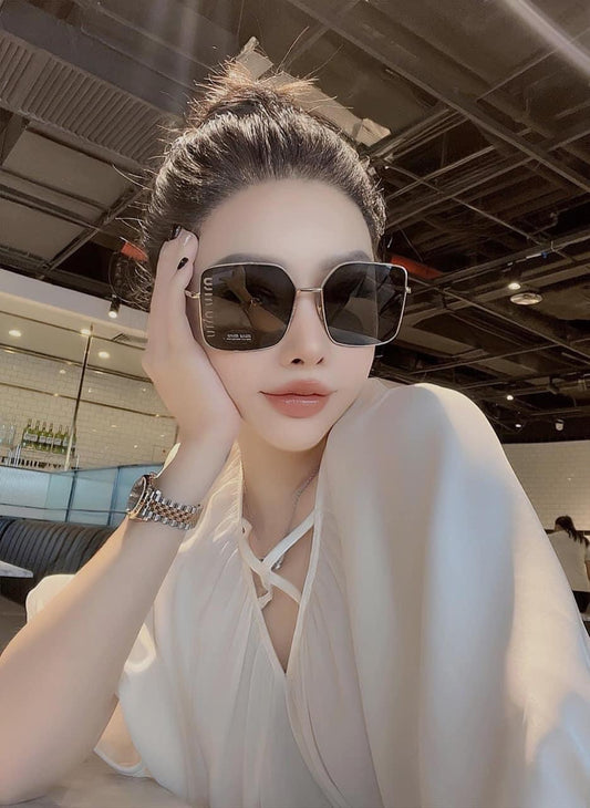 wearing MIU MIU MU 51YS ZVN5S0 SUNGLASSES