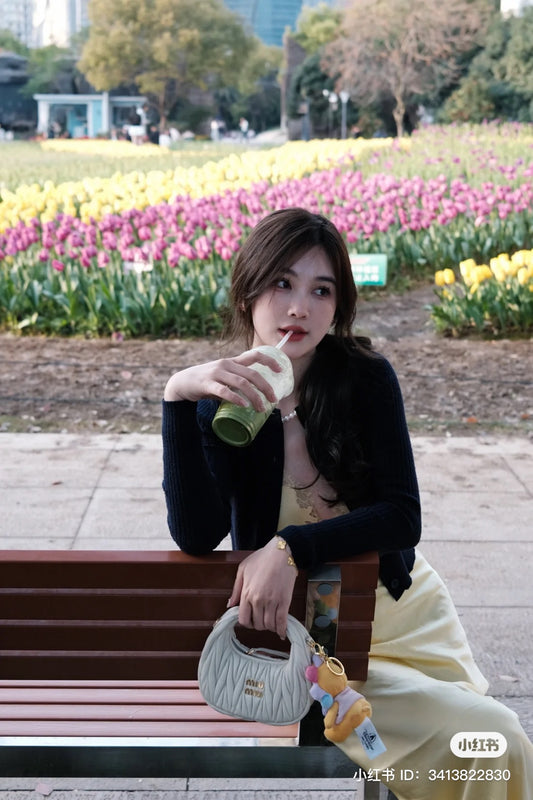 wearing MIU MIU WANDER MATELASSÉ NAPPA LEATHER HOBO MINI BAG IN CORNFLOWER 5BP078 N88 F0591