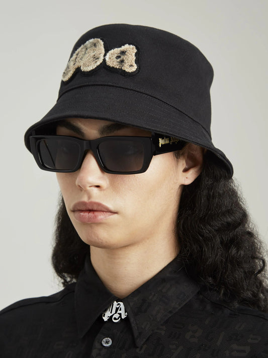 wearing PALM ANGELS BEAR BUCKET HAT BLACK