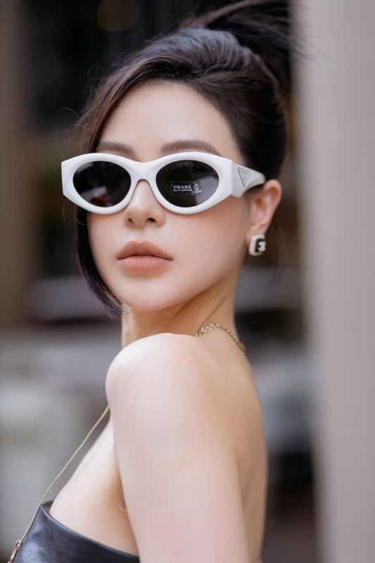 wearing Prada PR 20ZS 1425S0 White Oval Sunglasses SPR20Z_E142_F05S0_C_053