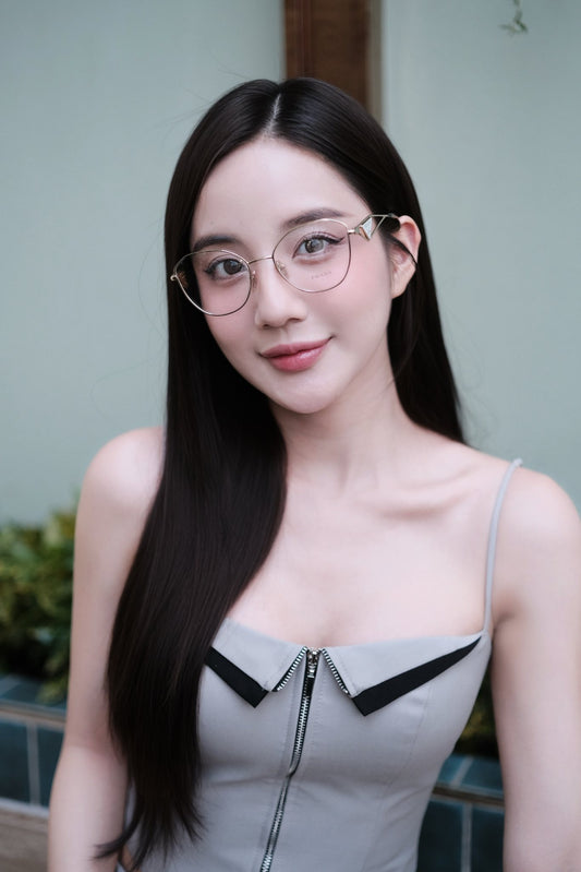 wearing Prada PR 52ZV ZVN1O1 Pale Gold Eyeglasses