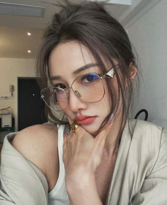 wearing Prada PR 57YS ZVN08N Symbole Light Gold Eyeglasses SPR57Y_SZVN_FE08N_C_057