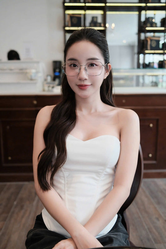 wearing Prada PR A51V 1BC1O1 Silver Square Eyeglasses