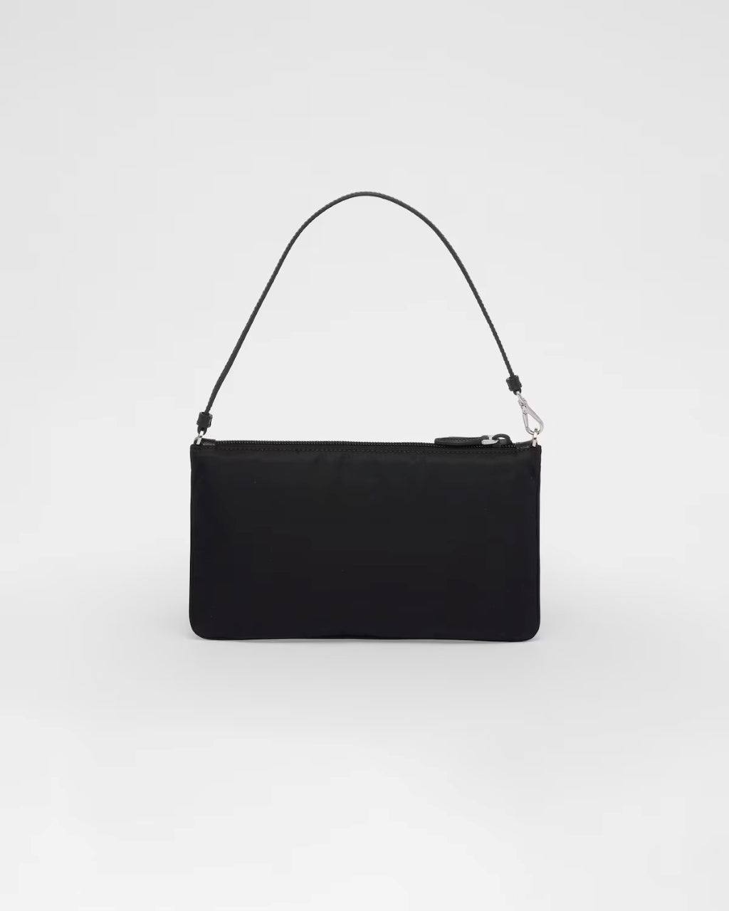 mặt sau túi PRADA RE-NYLON MINI BAG BLACK 1NI545_R067_F0002 authentic tại blankroom