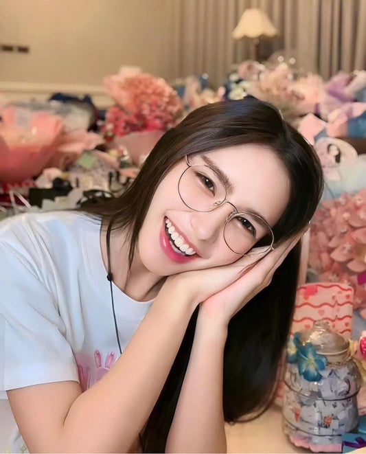 wearing SAINT LAURENT SL 555 OPT 003 ROUND EYEGLASSES