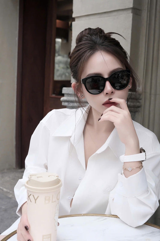 wearing Saint Laurent SL M29 003 Sunglasses