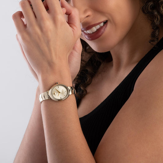 Woman wearing a Vivienne Westwood Armour Watch Gold VV314GDGD 8050164230401 on a plain background