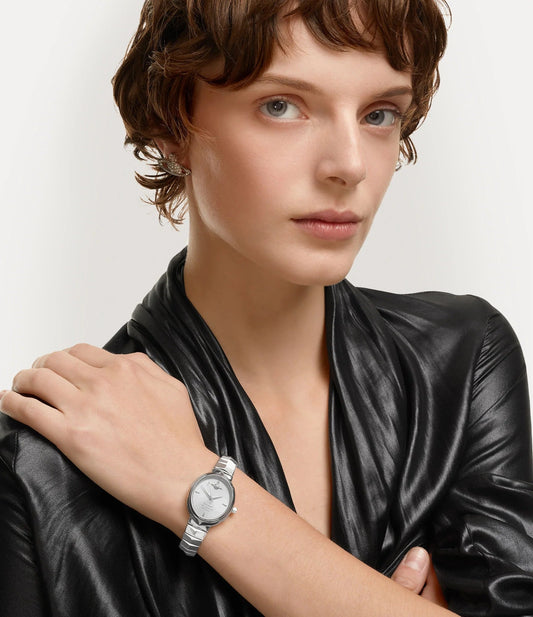 Woman wearing a Vivienne Westwood Armour Watch Silver VV314SLSL 8050164230395 on her left wrist with a plain background
