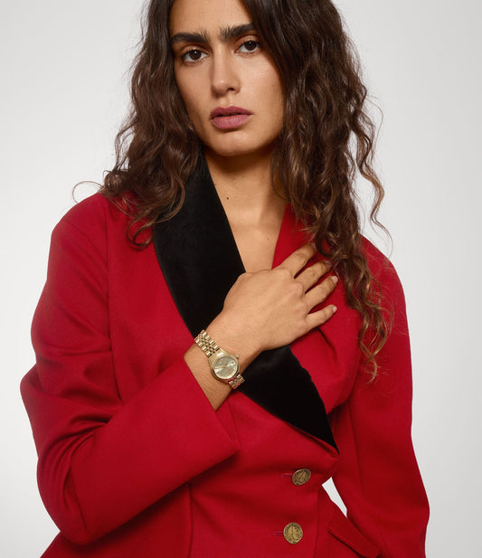 Woman wearing a red blazer with a Vivienne Westwood Little Camberwell Gold Watch VV311CPGD 8050164231835 on a white background