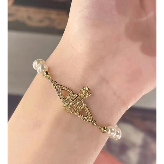 wearing Vivienne Westwood Mini Bas Relief Pearl Bracelet Gold Light 61030001-02R122 8050568217381