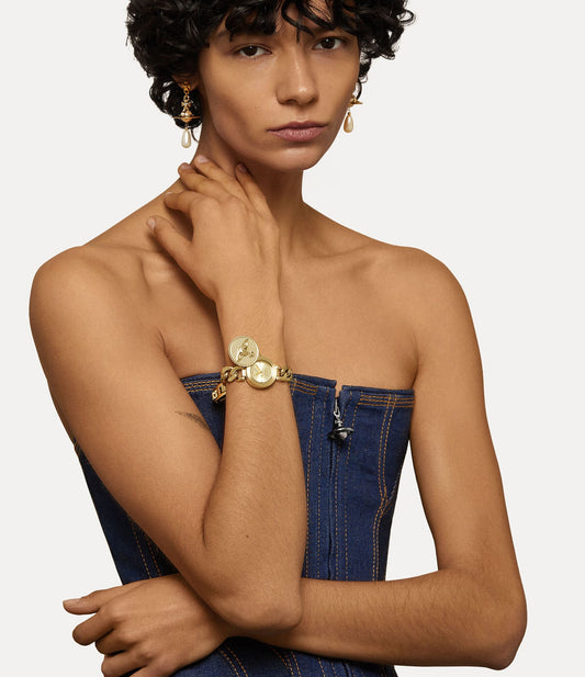 Woman wearing a Vivienne Westwood Orb Button Gold Watch VV323CPGD 8050164231088