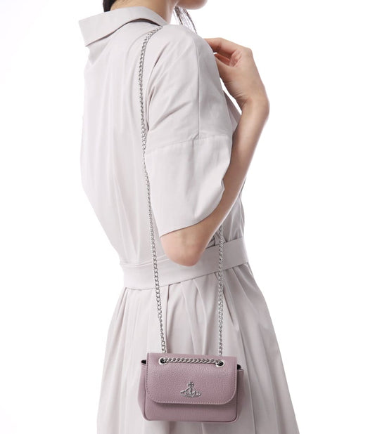 wearing Vivienne Westwood Pink Small Purse with Chain 5C01000CW-S000D-G402