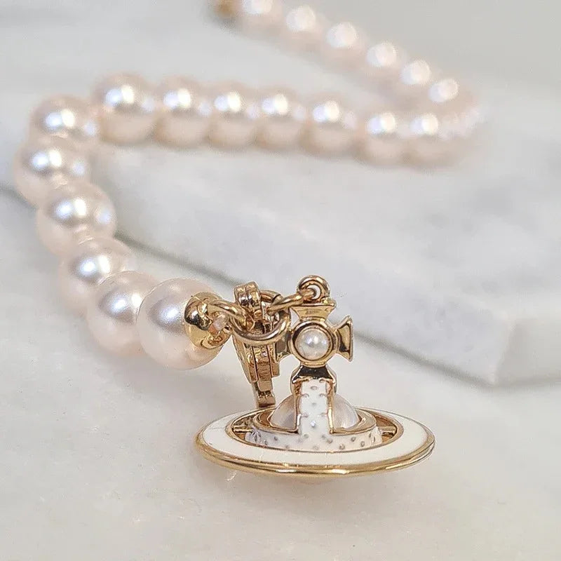 chi tiết VIVIENNE WESTWOOD SIMONETTA PEARL GOLD BRACELET 61020174-02R125-CN