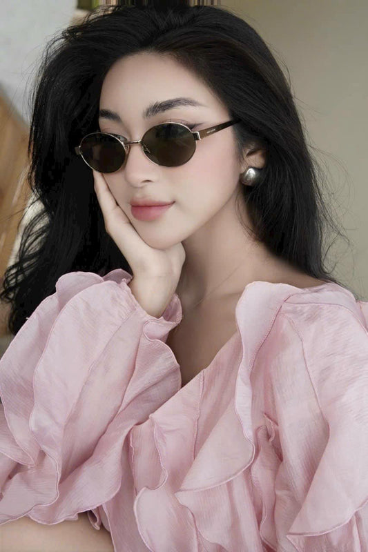 wearing YSL SL 692 LIGHT GOLD AND GREEN SUNGLASSES 779851Y99028002