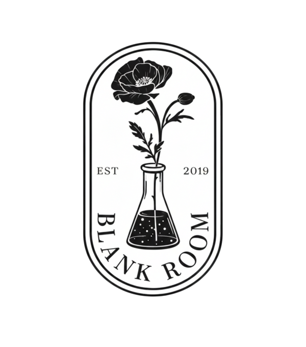 Logo of 'Blank Room' with a black flower and beaker design on a white background