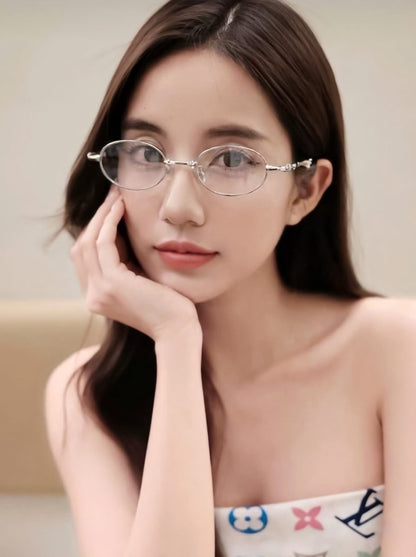 Woman wearing Gentle Monster Pico 02 Oval Glasses with a neutral background