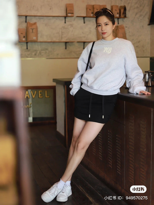 wearing ALEXANDER WANG PUFF LOGO SWEATSHIRT IN STRUCTURED TERRY GREY 4CC3221360050