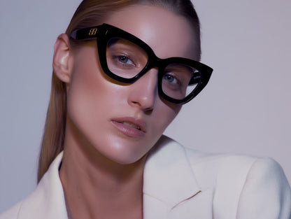 Woman wearing Balenciaga BB0238O-001 Butterfly Eyeglasses against a plain background