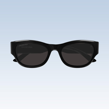 Balenciaga BB0389SK Black Rectangular Sunglasses with a glossy black frame and dark gray lenses, shown against a light blue gradient background.
