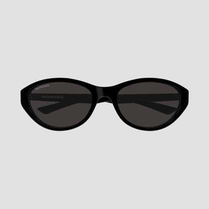 Balenciaga BB0404SK 001 Black Oval Sunglasses and white branding text on the eyepiece, shown against a plain white background.