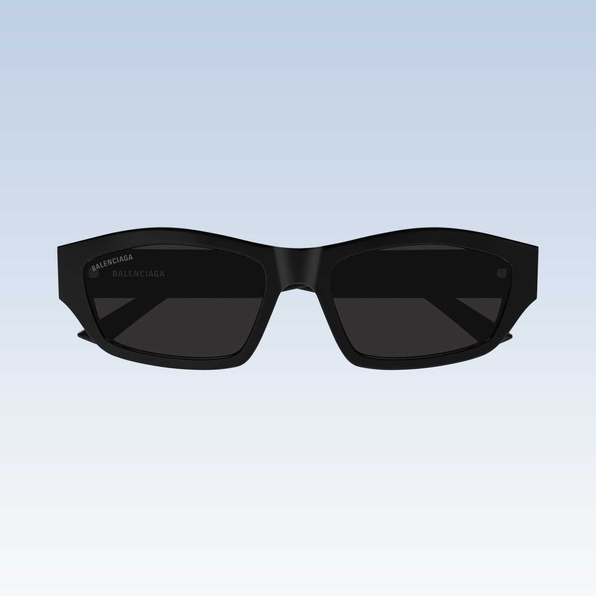 Balenciaga BB0448SK 001 Black Rectangular Sunglasses with a chunky geometric frame and dark lenses, shown against a light blue gradient background.