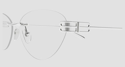 A close-up studio shot of a pair of Balenciaga BB0489O-001 Silver Rimless Butterfly Eyeglasses with a minimalist silver metal bridge and temple arm, shown against a solid light gray background.