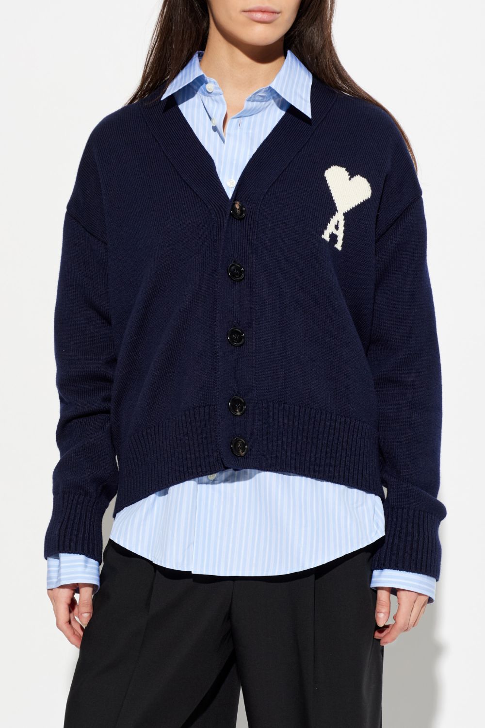 Ami Paris Blue Wool Ami De Coeur Cardigan UKC380.KN0156.A116 with a heart and 'A' emblem over a light blue shirt on a white background
