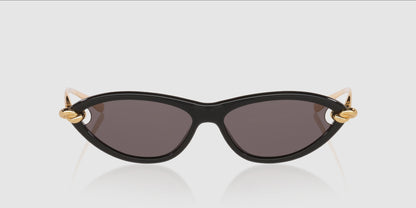 Bottega Veneta BV1390S Gold Knot Cat-Eye Sunglasses with dark lenses and gold metal accents on the temples, shown against a light gray background.