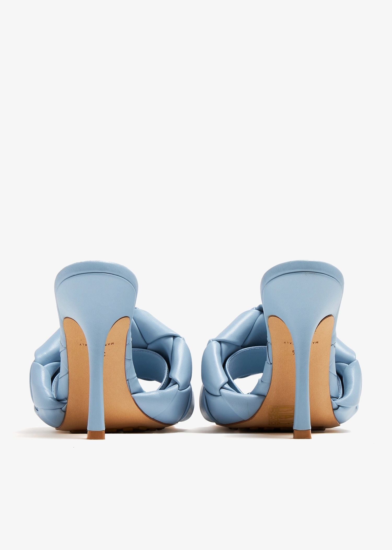 behind Bottega Veneta Lido Mule Pale Blue 608854VBSS04335 on a white background