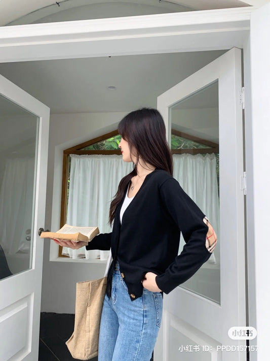 wearing Burberry Vintage Check Elbow Patch Dornoch Merino Wool Cardigan Black 8024593