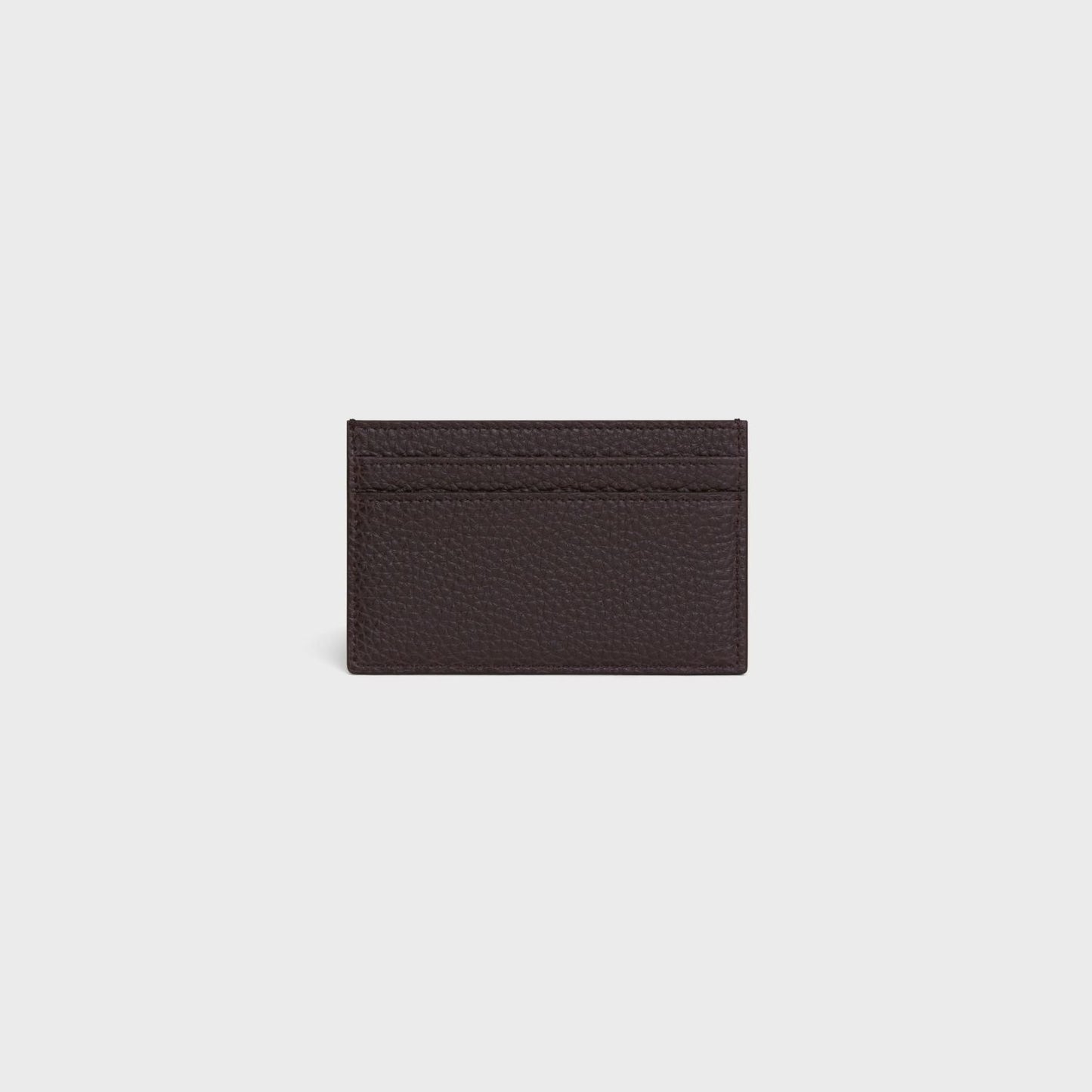 behind Celine Card Holder in Grained Calfskin Espresso 10N763GTH.19ES on a light gray background