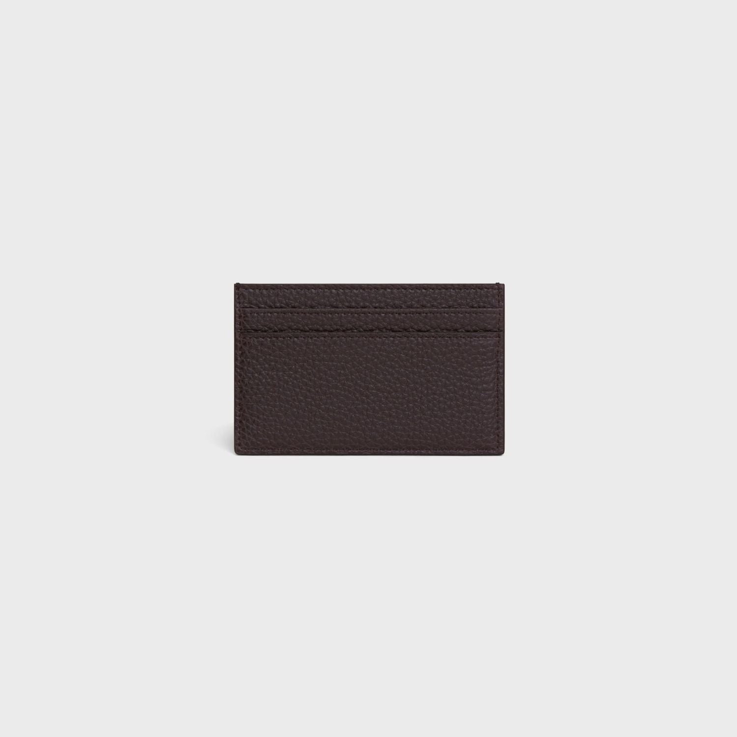 behind Celine Card Holder in Grained Calfskin Espresso 10N763GTH.19ES on a light gray background