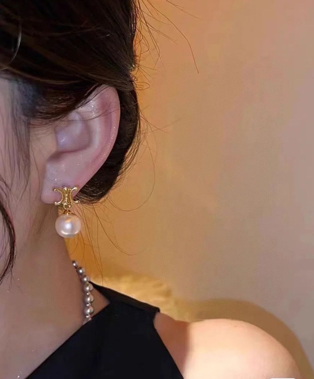 wearing Celine Les Perles Earrings with Glass Pearls in Gold-Finish Brass 460TZ6BPE.01GI