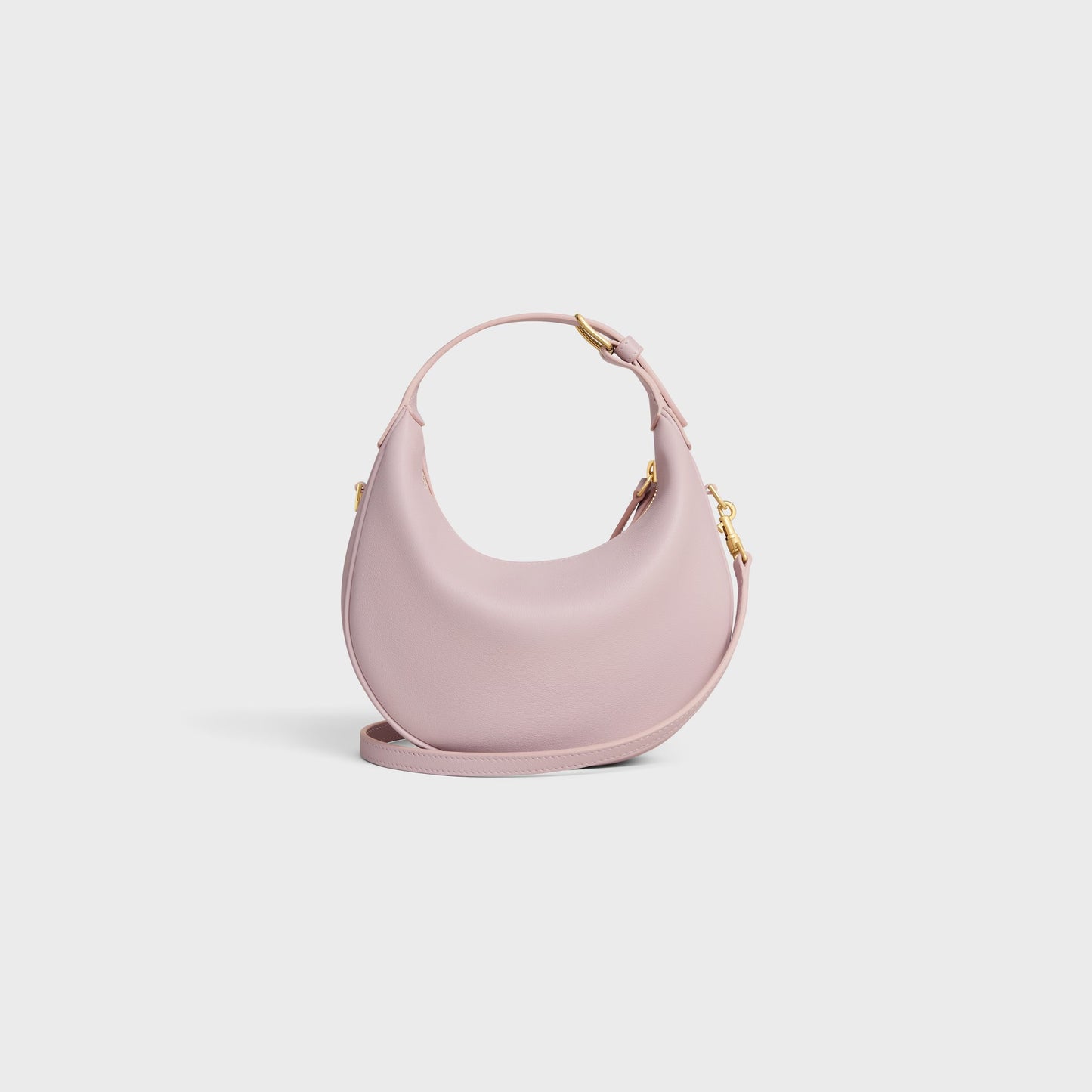 behind Celine Teen Celine Lulu in Grained Calfskin Bleached Pink 120723ENY.25BD on a light gray background