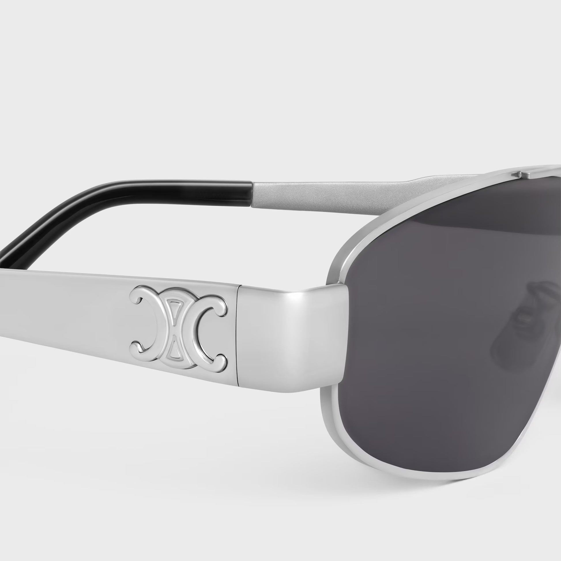 Celine Triomphe Metal 03 Sunglasses in Metal – CL40281U 16A with a logo on the frame against a light gray background