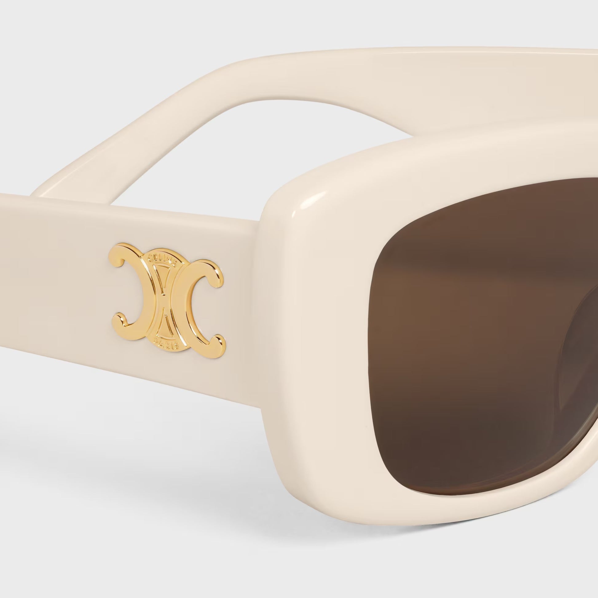 CELINE Triomphe 04 Sunglasses in Acetate Ivory CL40216U 25E with a gold logo on a light gray background