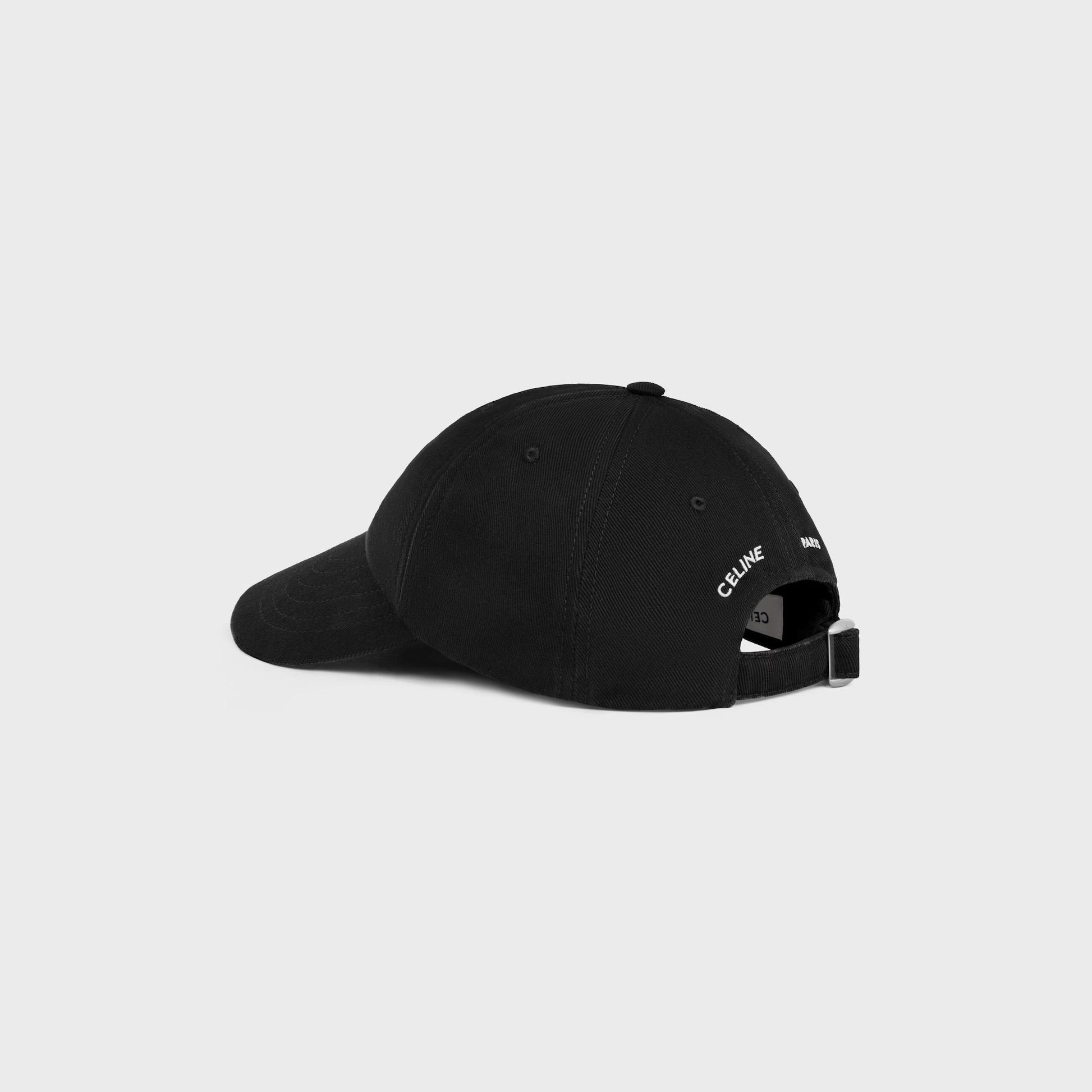Black cap with celine branding on a light gray background
