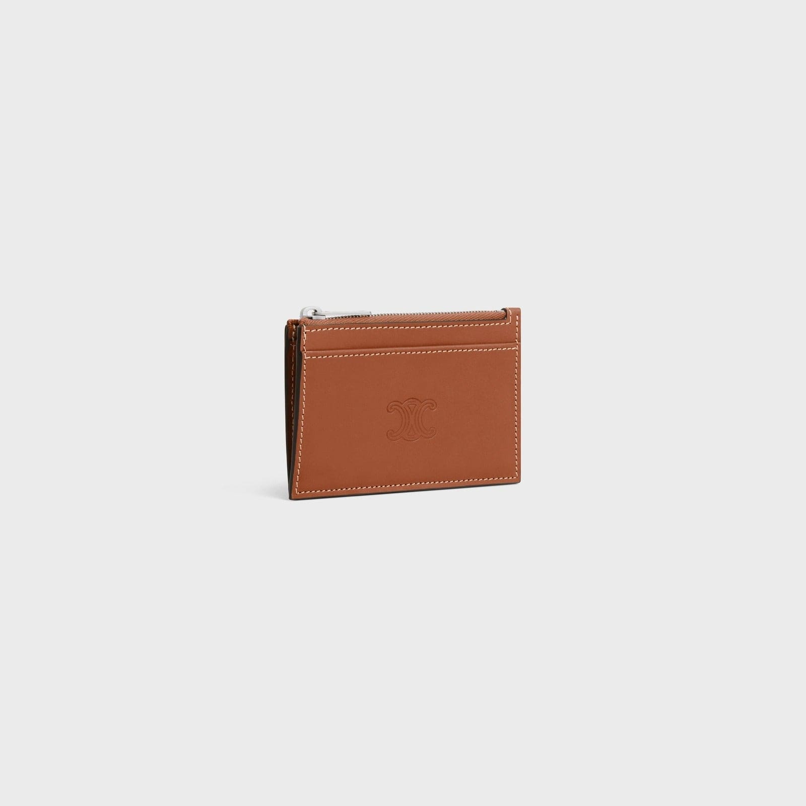 tổng thể ví đựng thẻ CELINE ZIPPED CARD HOLDER NATURAL CALFSKIN TRIOMPHE EMBOSSED TAN 10F993FQ5.04LI
