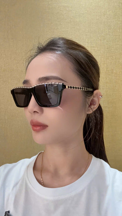 Person wearing Chanel CH5548Q C622T8 Sunglasses with a gold background