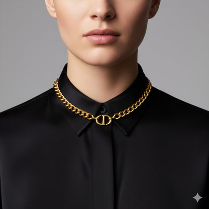 Person wearing a black shirt with Dior CD Navy Choker Necklace on a gray background
