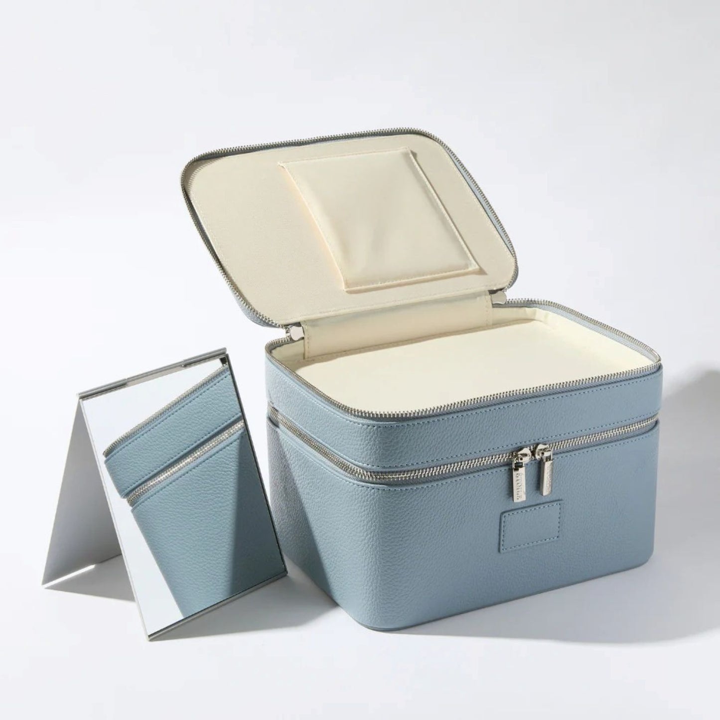 Étoile Duo Vanity Case Rodin Blue Limited Edition with open lid and mirror on a white background