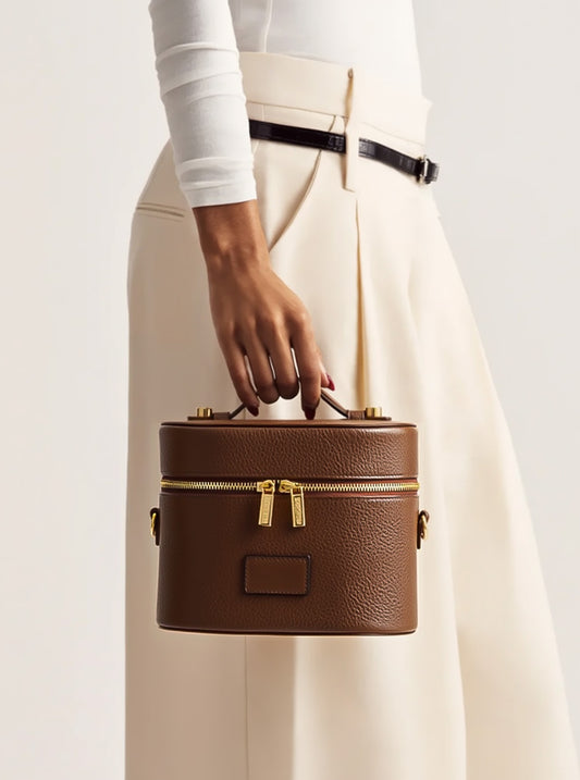 Women holding Etoile Oval Toiletry Case Espresso