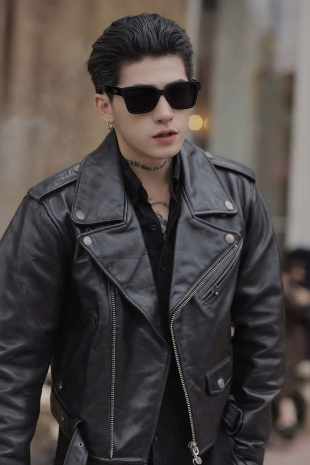 Person wearing a black leather jacket and Gentle Monster Gent 01 in an urban setting